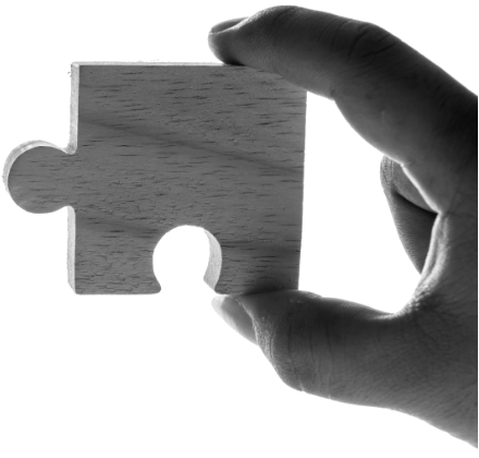 A hand-held puzzle piece pic to indicate the need of business partnerships.